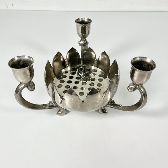 This Mid-Century Lotus Flower Centerpiece Vase is framed with three Candlestick Holders. It comes with a flower frog plate...