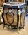 A striking statement piece inspired by the grandeur of French Louis XV furniture, this cabinet combines a dramatic glossy...