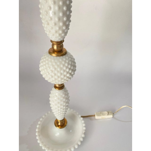 This table lamp has been made in Italy Circa 1970. It is made of glass and brass. Wear consistent with age and use. Minor...