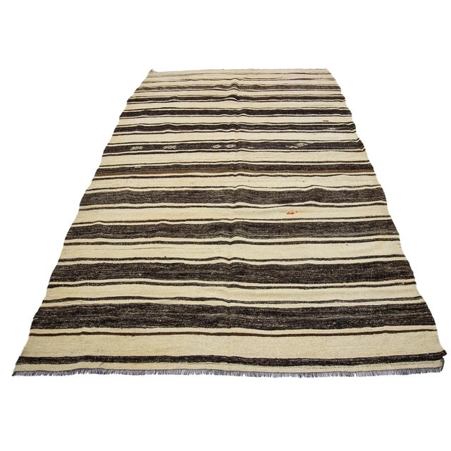 Striped handwoven vintage kilim rug from Afyon region of Turkey.Approximately 50-60 years old. In very good condition