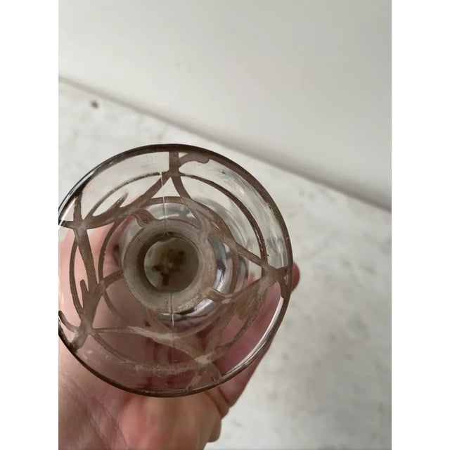 Lovely Art Nouveau glass vase with sterling silver overlay. A tulip flared top creates a feminine floral touch. The base...