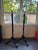 Timeless Empire-revival style. This pair showcases tapered black columns highlighted by gold accents, distinctive leaf-...