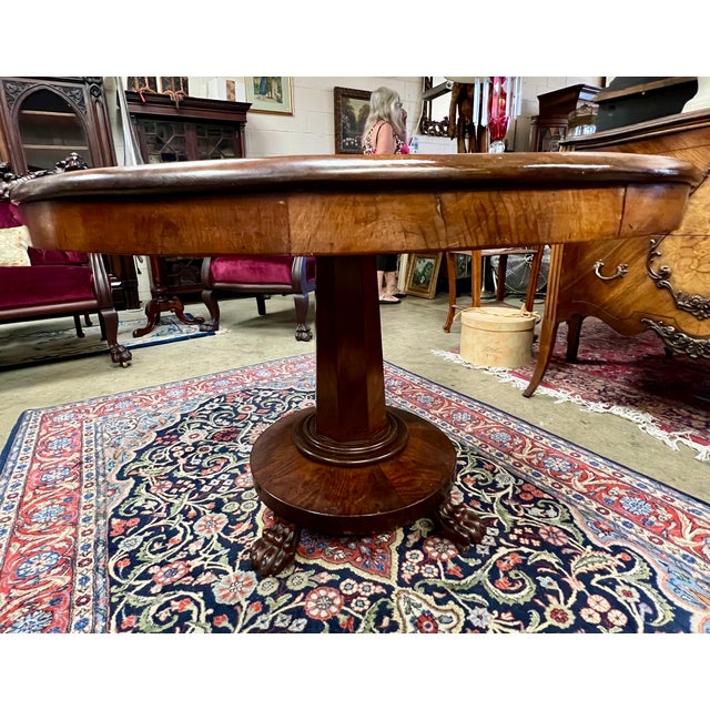 Rare parlor table crafted of walnut and mahogany. Carved feet. Circa 1880s. In amazing condition. 40"d x 27.5 h