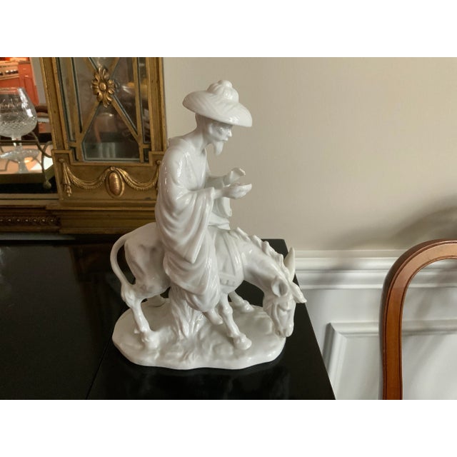 Impressive details on this statue of a bearded Japanese Man in Kimono Riding A Donkey/Usagiuma - White Porcelain Figurine...