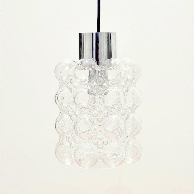 Stunning pair of mid-century modern pendant lights designed by Helena Tynell for Limburg, one of the most famous German...