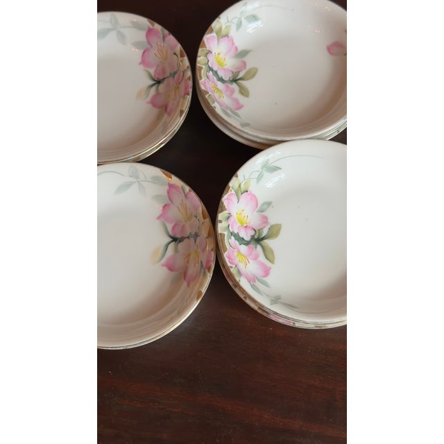 Early 20th century Noritake porcelain berry bowls, hand-painted in the Azalea pattern with pink flowers and gold trim....