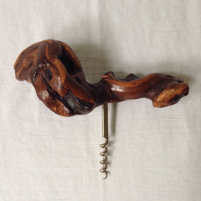 A beautiful vintage corkscrew with a knobby grape wood grip. Marked "Made in France." It will add a natural pop of texture...
