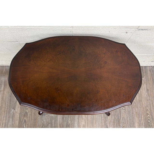 This is a gorgeous antique Victorian Eastlake flame mahogany parlor table dating to approximately 1880–1900. Crafted from...