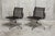 Set of two Eames EA 108 Aluminum Chairs, designed by Charles and Ray Eames and produced by Vitra. The chairs feature the...