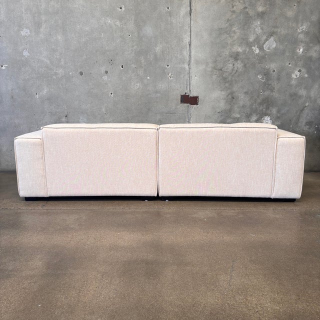 This vintage inspired Nordic Block Sofa is upholstered in a scotch guarded cotton linen blend in the color sand. It is...