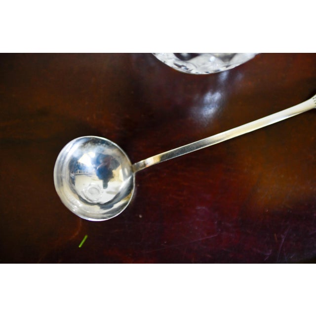 This sterling silver serving spoon by Arias, Fine Peruvian Silversmiths, was part of a 1960s wedding trousseau. It...