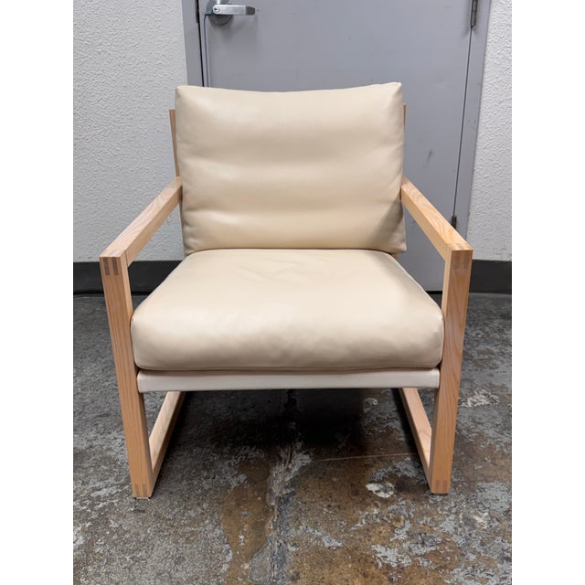 Design Plus Gallery presents a Chiara Lounge Chair from EQ3. This contemporary lounge chair pairs a streamlined wood frame...