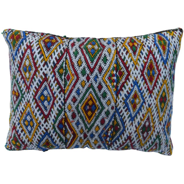 One-of-a-kind Moroccan pillow handwoven by the Berbers of the High Atlas Mountains. Featuring an ornate and lively diamond...