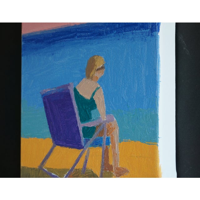The end of the day was always my favorite time at the beach. Here on the bay side on Cape Cod a woman sits looking out at...