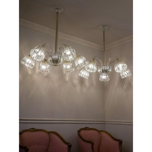 A pair of vintage murano blown glass chandeliers, made in italy in the 1940s and attributed to barovier & toso, one of the...