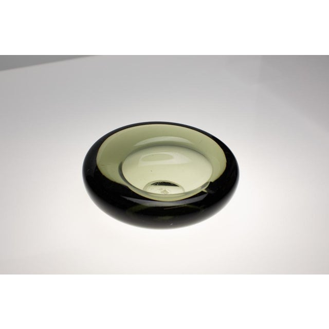 This set consists of two ashtrays from the Akva series from the Danish glass manufacturer Holmegaard. Both were designed...