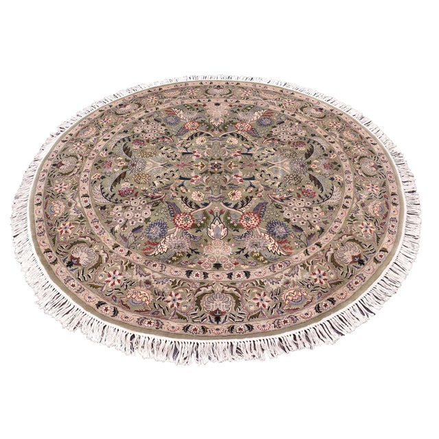 This hand‑knotted Pak Persian round rug showcases the finest expression of traditional Persian artistry. Each piece is...
