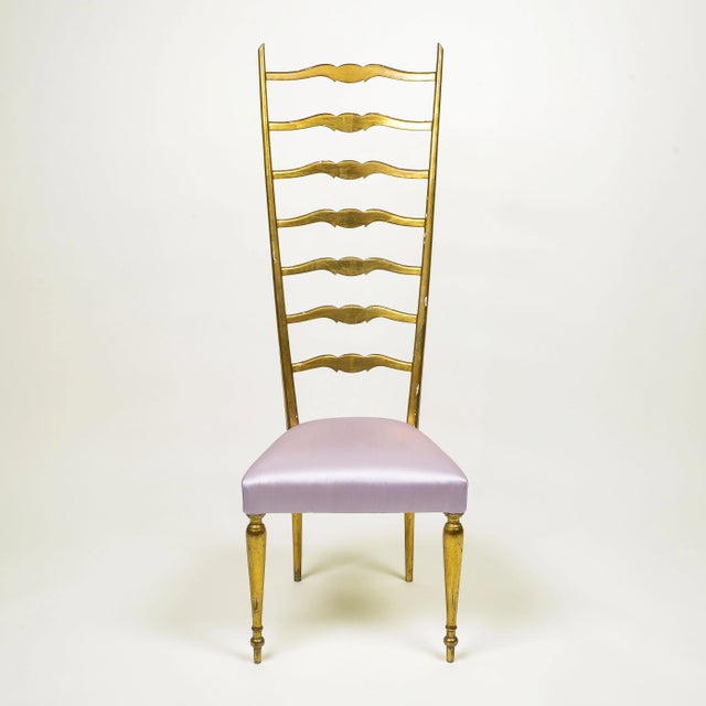 With elongated ladderback; upholstered in lavender silk satin.