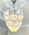 Stunning Murano glass chandelier. The glass is hand-cut into leaf shapes. This chandelier features a gold-plated metal...
