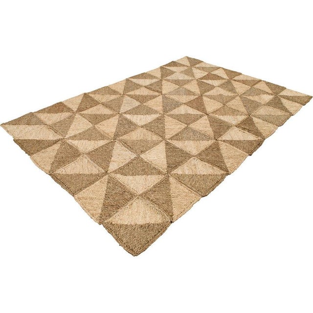 Our Mavis rug made by skilled artisans with natural seagrass and off-white corn husks. Materials are pulled by hand from...