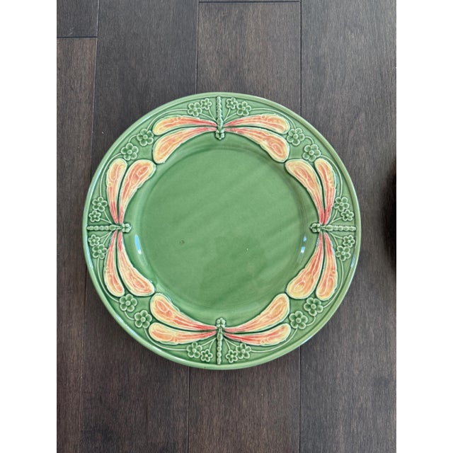 Unique and large charger plate from BP with adorable dragonflies in pinkish or orangish color all round. They appear to be...