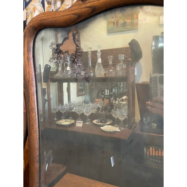 Antique oak dresser with tilting mirror from the early 20th century. Quarter sawn oak grain 4-drawer dresser with mirror...