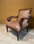Bring stately, Old-World character into your home with this exceptional Empire Revival open armchair. Revival History: The...
