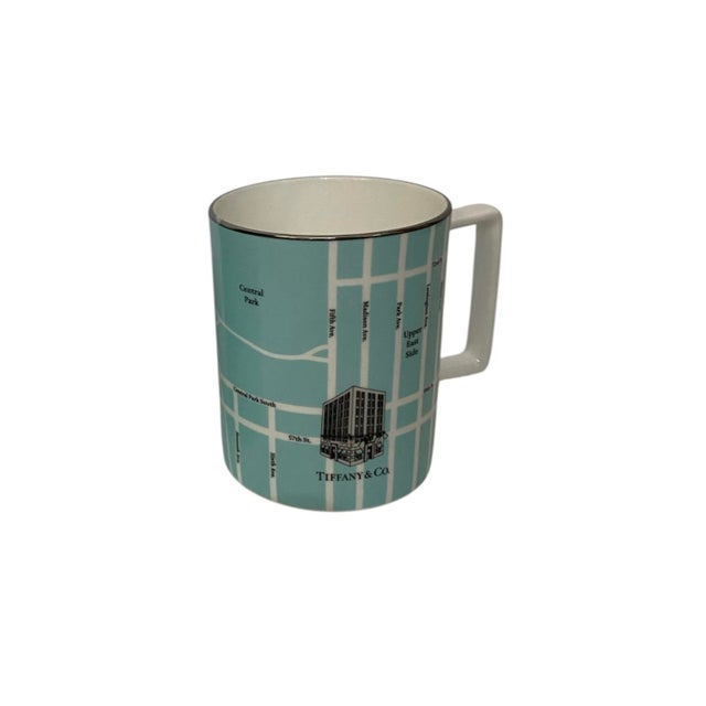 Tiffany & Co., limited-edition New York Fifth Avenue Manhattan Map set of 2 mugs in Tiffany Blue, White with a Silver rim....