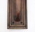 Art Deco style door pull made of bronze with a simple handle and rectangular shaped back plate. The original mounting...