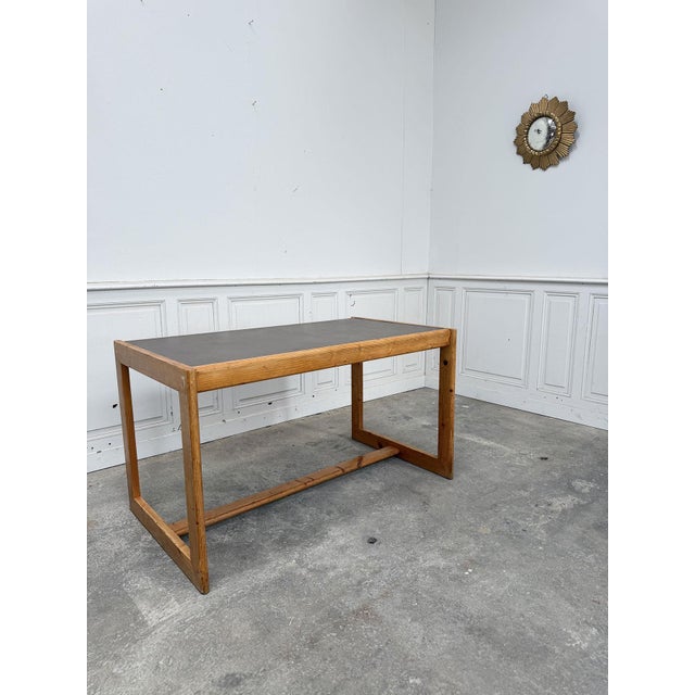 Vintage 1950s desk by Lyon-based designer and cabinetmaker André Sornay. This work table is a fine example of innovation,...