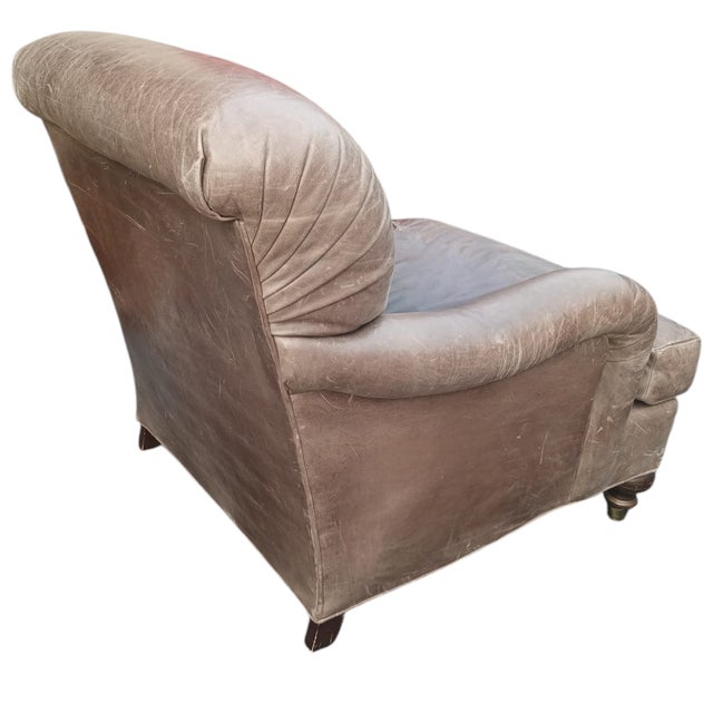 Timeless Comfort: Sink into the rich history and undeniable comfort of this vintage leather armchair. Aged to Perfection:...