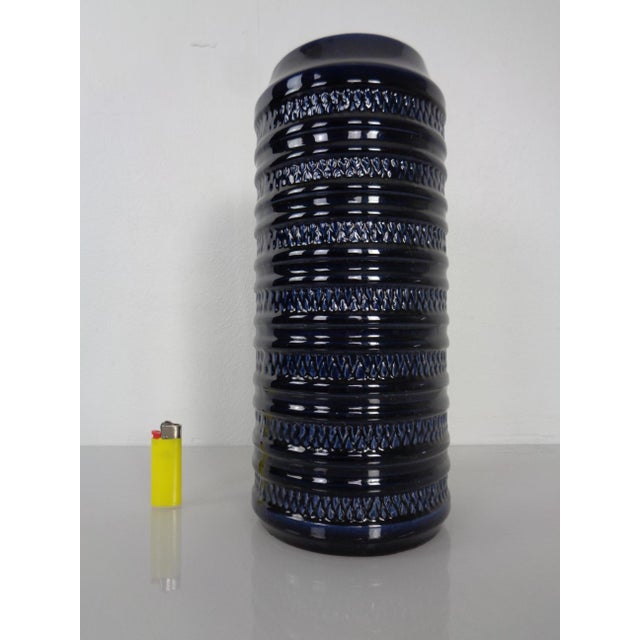 Glazed, dark blue ceramic vase by Carstens Tönnieshof. Marked on the underside with E.4-30 This piece has an attribution...