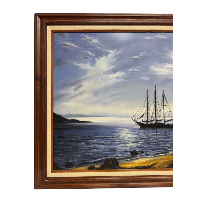 Marine oil painting featuring a sailing schooner on calm water under a moody sky. Oil on canvas with a linen border, in a...