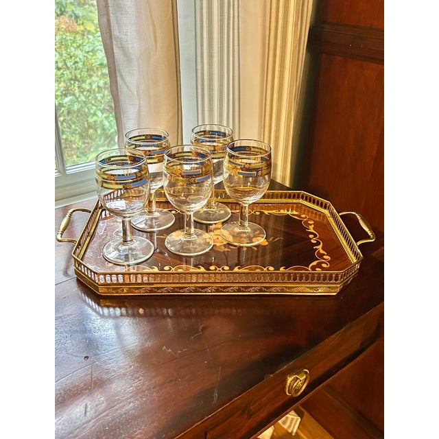 These mid century blown glass wine glasses are by Culver, known for distinctive glassware. The pattern is “Empress”,...