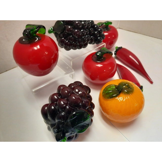 Set of 8 solid glass fruits and vegetables. Great together in a bowl or separate as accents on a shelf to add color and...