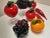 Set of 8 solid glass fruits and vegetables. Great together in a bowl or separate as accents on a shelf to add color and...