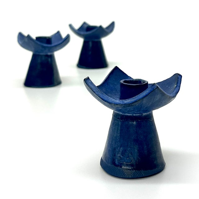 Indigo-blue candle holders, set of 3. This is a mid-century modern set of indigo-blue artisanal pottery candle holders in...