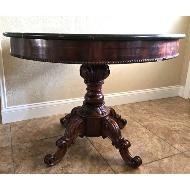 19th Century French Louis Philippe Period (1830-1848) Marble Top Center Table, with magnificent hand-carved mahogany...