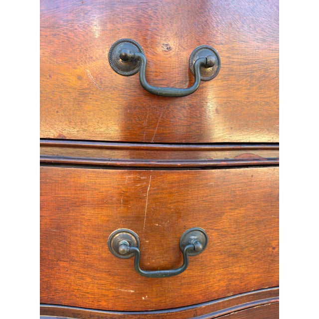 Vintage mahogany serpentine-front chest of drawers featuring a pink marble top. Has some household wear, overall in great...