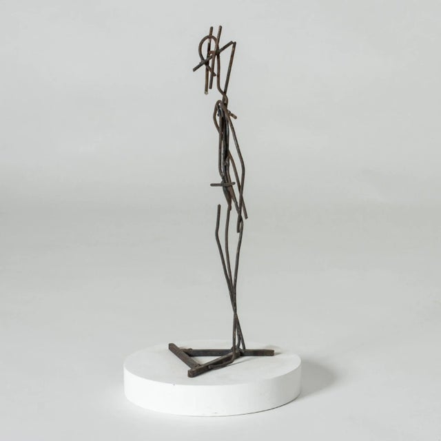 Sculpture by Fred Leyman in the the abstract form of a man, poised as if asking someone to dance. Sensitively executed in...
