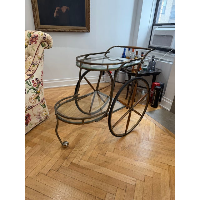 Beautiful antique brass and bamboo wood bar cart on wheels. Vintage and in very good condition.