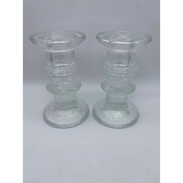 Originally designed in 1966 by Timo Sarpaneva for Iittala, Finland. The Festivo candle holder features a chipped ice look....