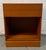 Beautiful mid-century modern Danish teak nightstand featuring clean minimalist lines and the warm, richly grained...