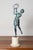 This elegant early 20th-century French statuette captures the grace and charm of a female figure engaged in a lively...