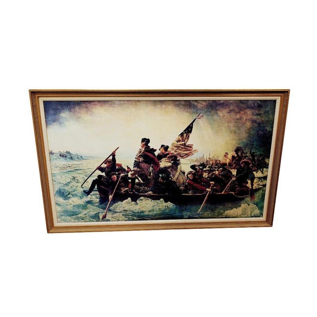 This is a framed art print of Emanuel Leutze's 1891 painting, Washington Crossing the Delaware. This iconic image depicts...