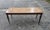 Rectangular inlaid low coffee table 1950s with highly decorated top and pinned stems. Measurements 121 x47 x h 50 category...