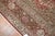 An oversize Antique Persian Tabriz rug woven early 20th century with cinnamon colored ground and soft brown medallion. The...