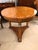 A fine Biedermeier center table. Cherrywood with ebonized fruitwood details and carved giltwood caryatids. Full...