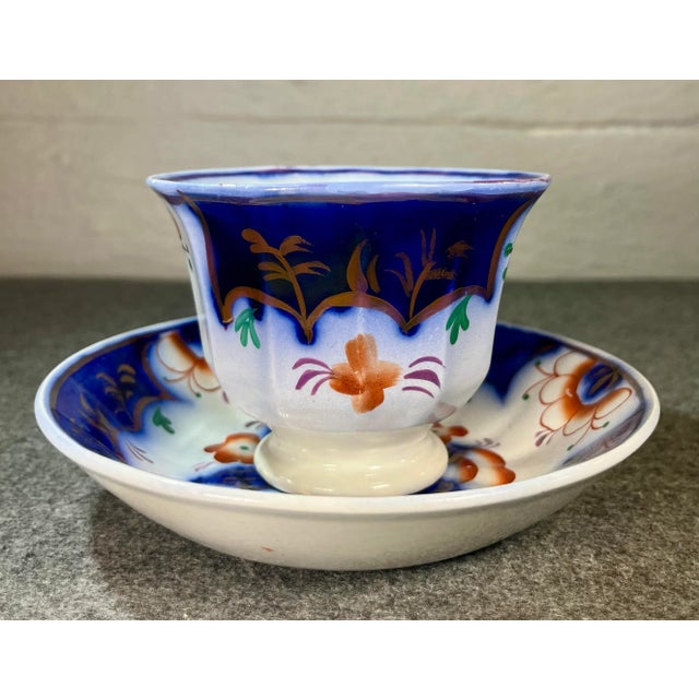 Folk-art style decoration often referred to as the “pinwheel” design. Rich colors of cobalt blue, orange, and green with...