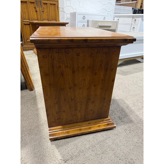 This Drexel Heritage Velero nightstand is a handsome example of Spanish Revival design, blending Old World craftsmanship...